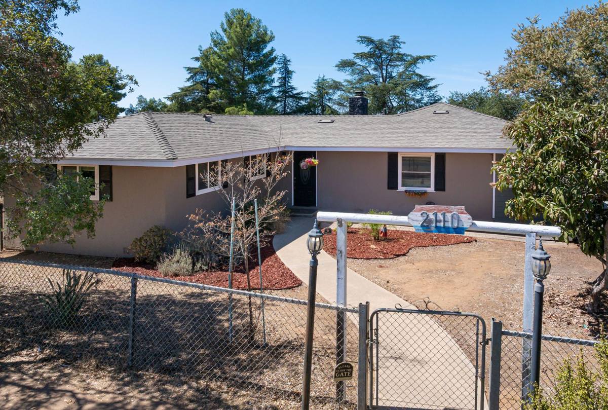 Raised view of the home behind the 2110 gated entry