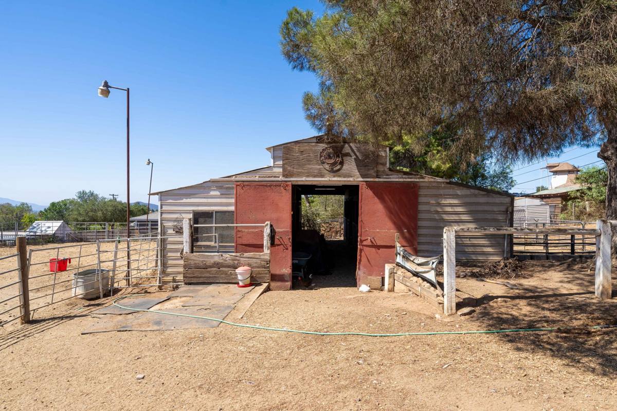 Barn with red sliding doors and open center aisle