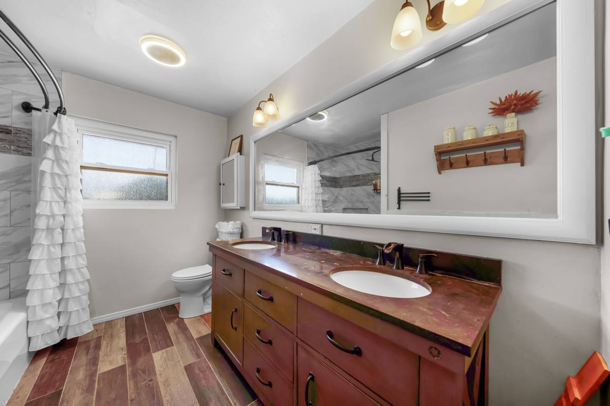 Bathroom with double vanity and large mirror