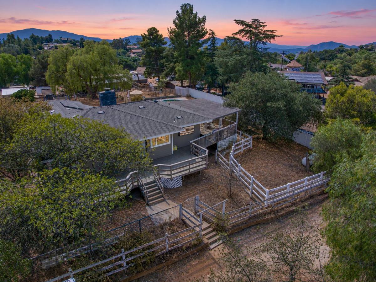 Aerial view of the wraparound deck with mountains at sunset