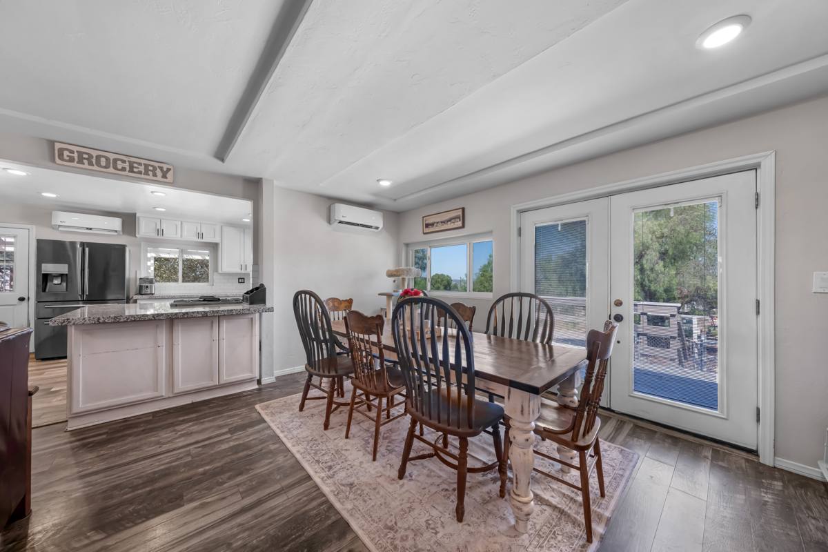 Dining area with French doors to the deck, next to the kitchen